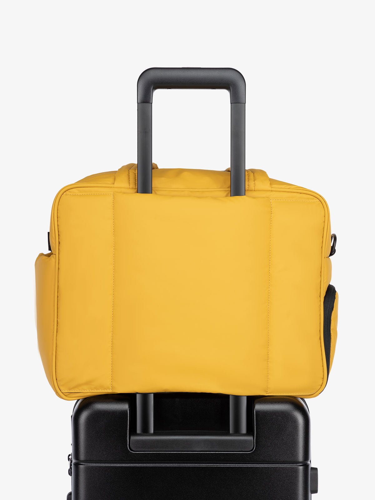 yellow Luka duffel bag and weekender with luggage sleeve