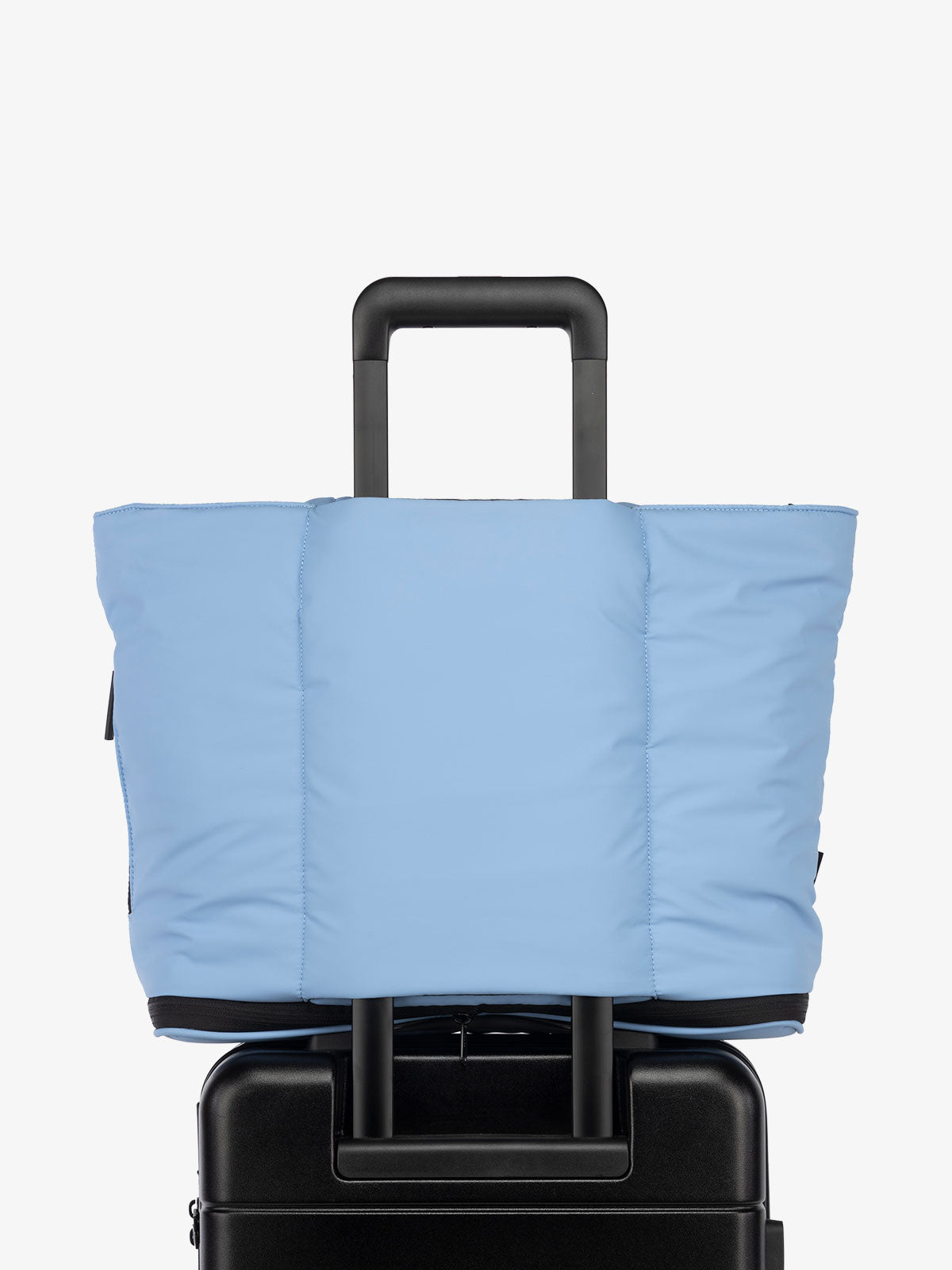 CALPAK Luka expandable travel bag with laptop compartment and trolley sleeve in winter sky blue