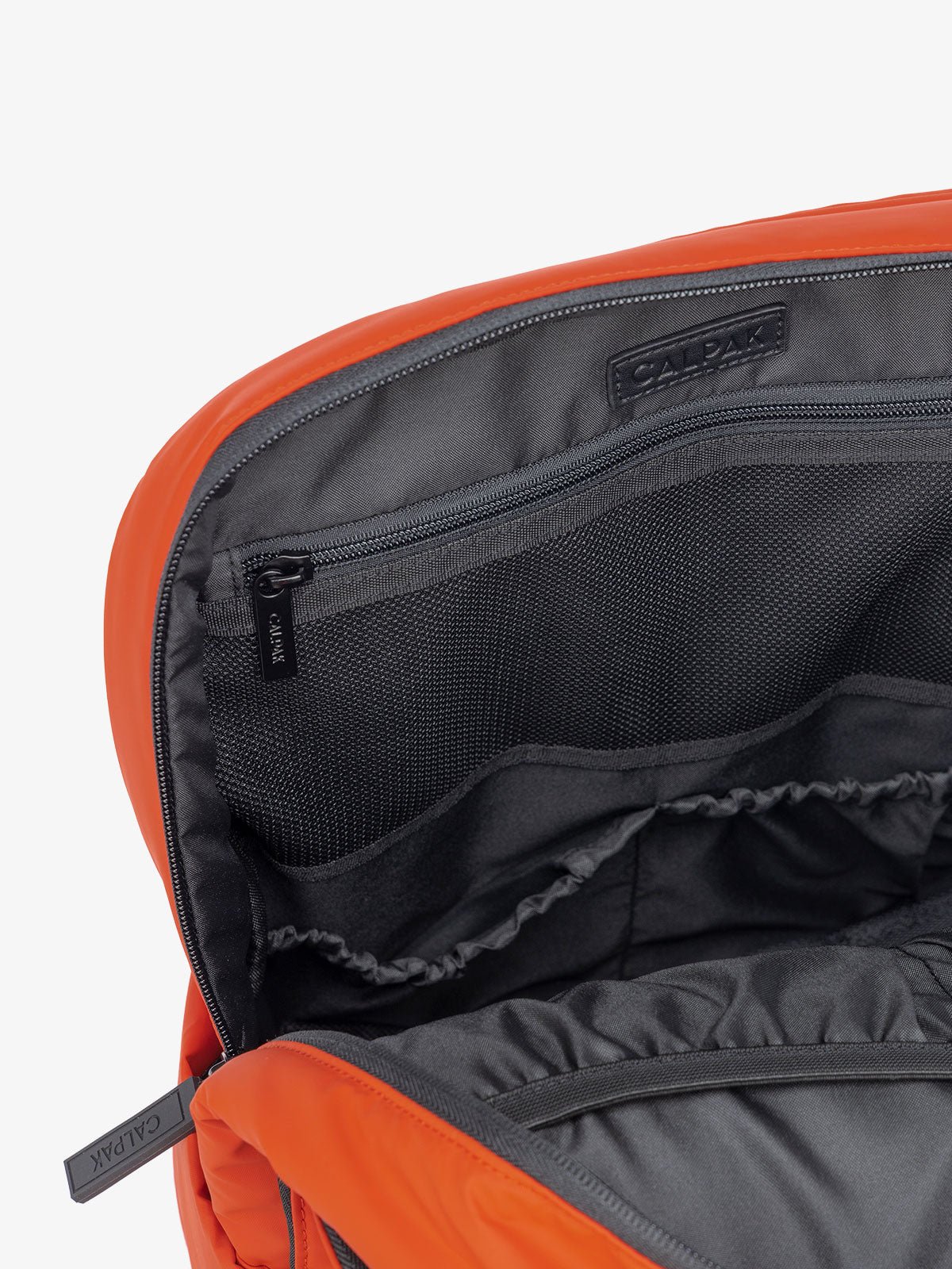 laptop sleeve of luggage backpack in red orange brick