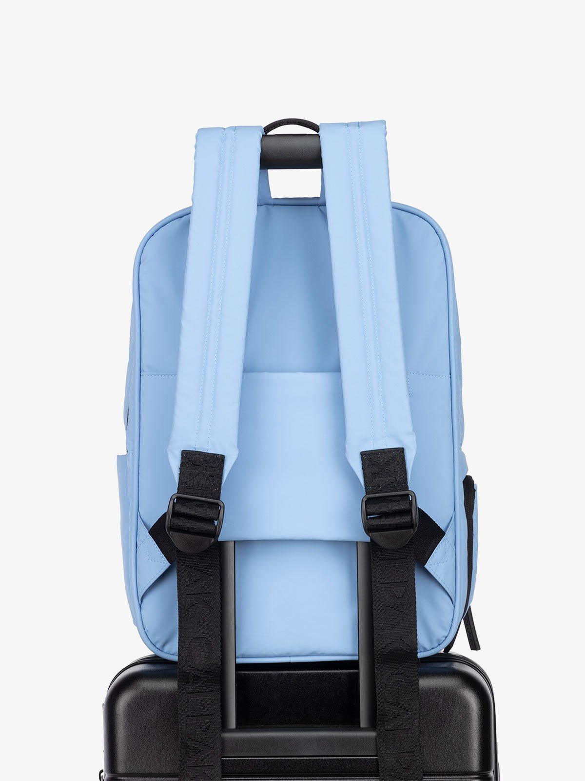 CALPAK Luka Laptop Backpack with adjustable shoulder straps and luggage sleeve in light blue