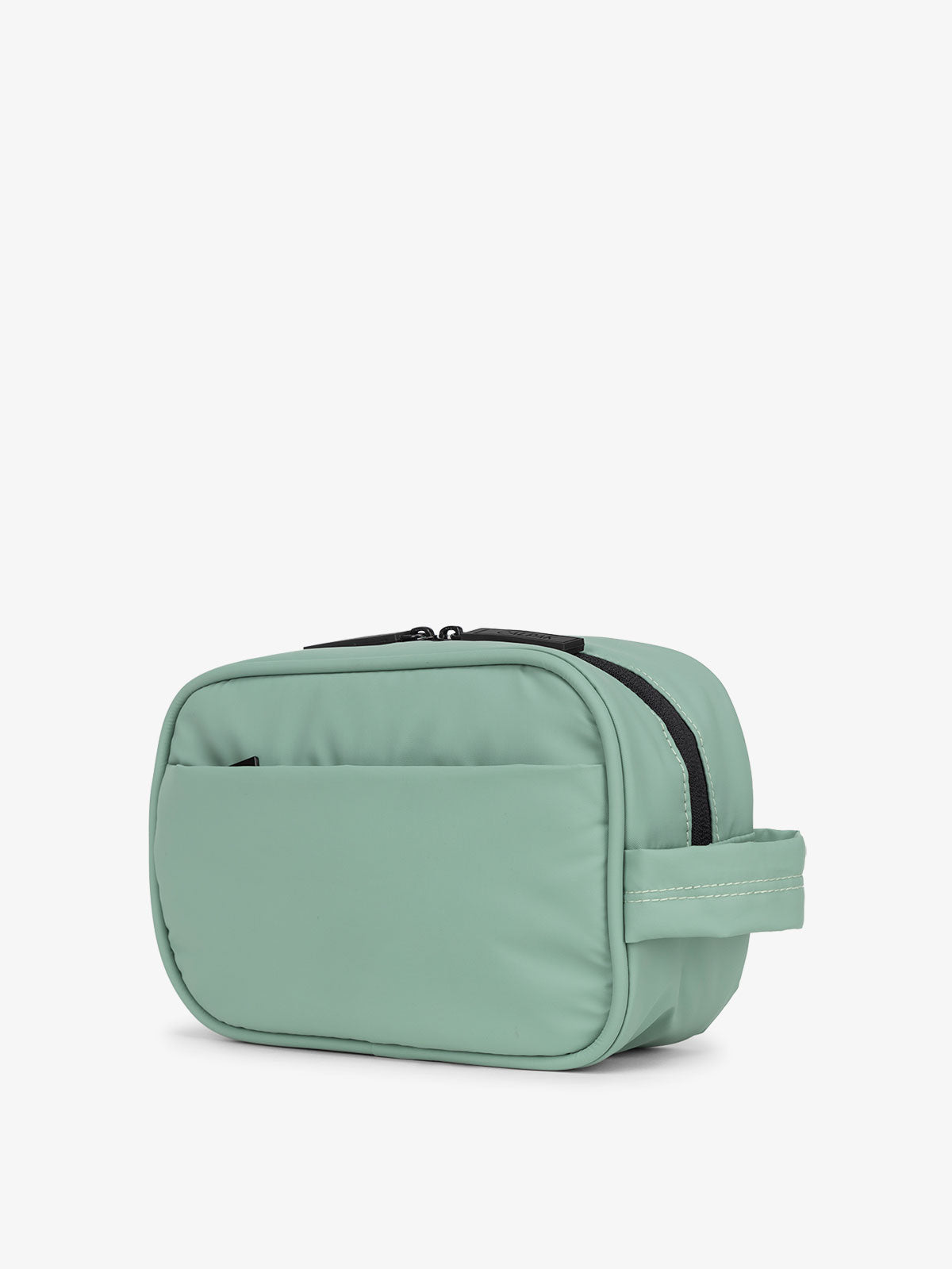 CALPAK Luka Toiletry Bag for travel organization with soft puffy exterior and multiple pockets in green