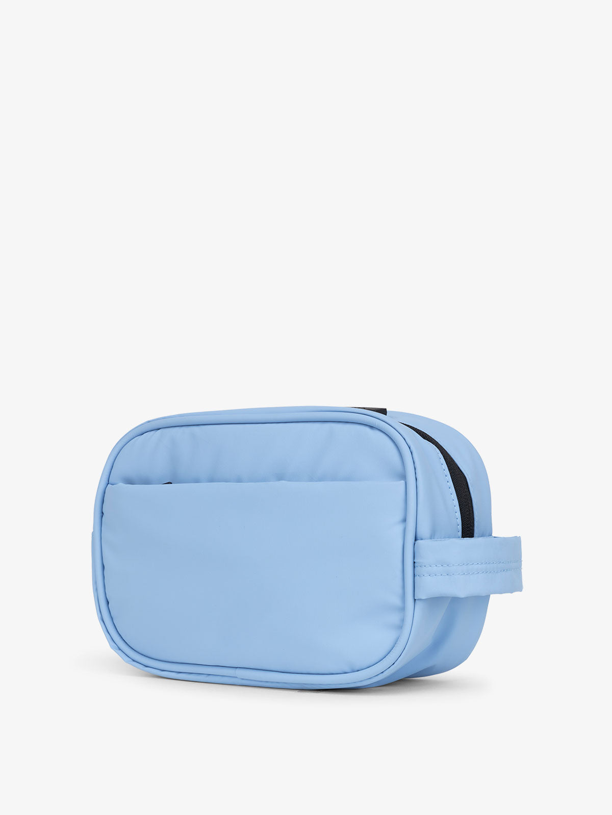 CALPAK Luka Toiletry Bag for travel organization with soft puffy exterior and multiple pockets in light blue