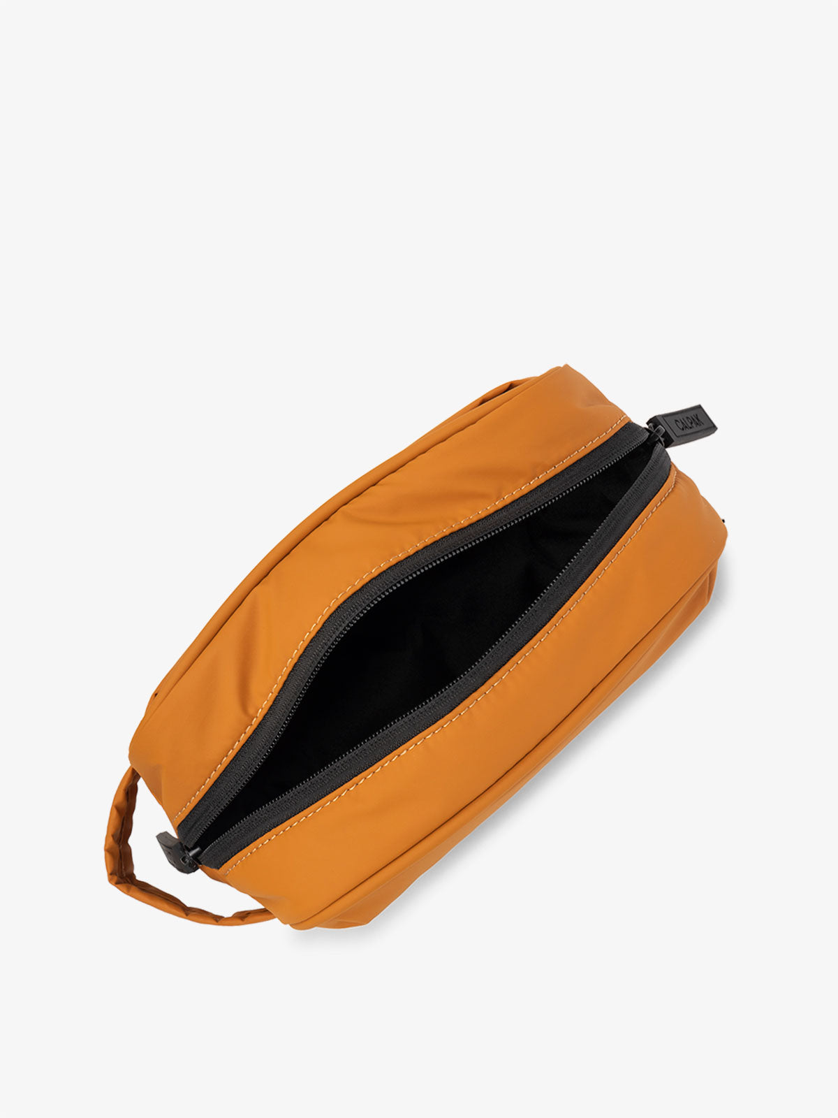 CALPAK Luka Toiletry Bag with zippers in pumpkin