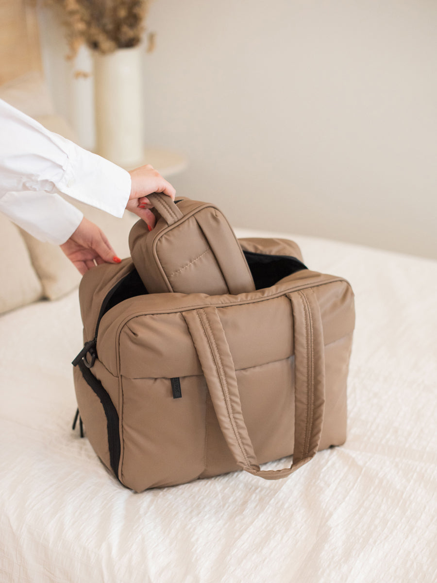 brown Luka toiletry bag with hanging strap