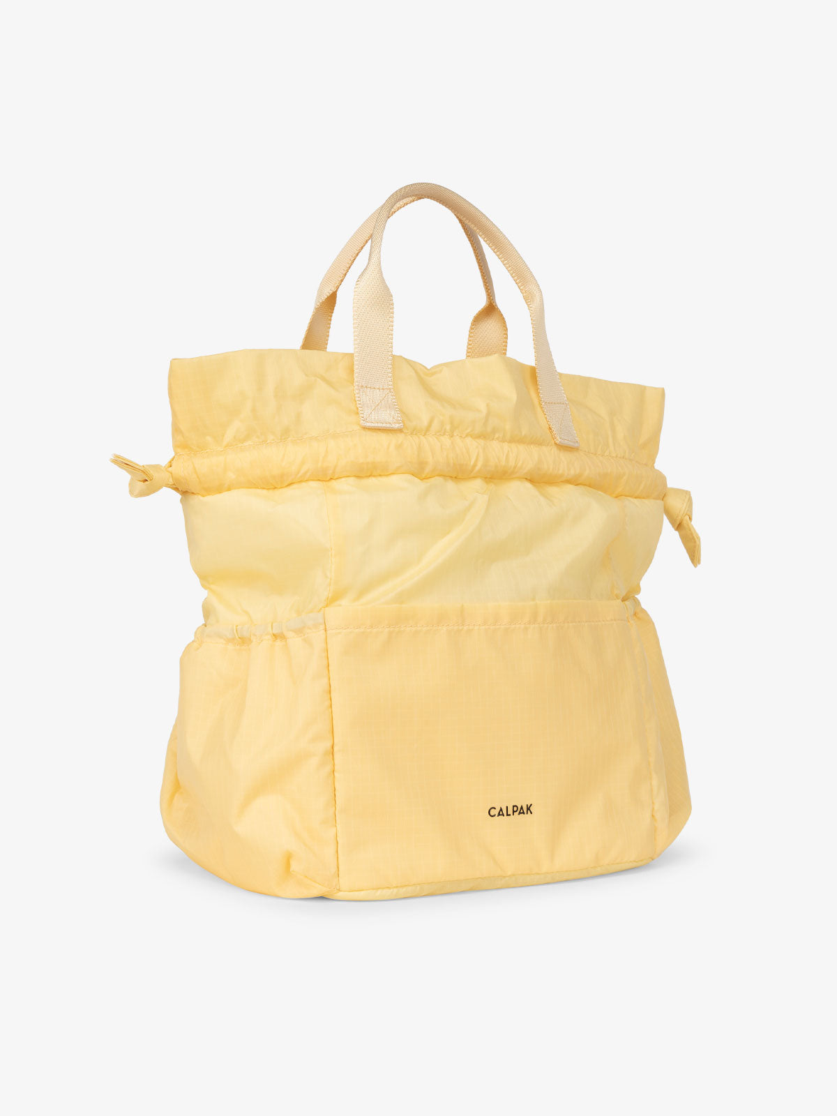 CALPAK insulated lunch bag in yellow lemonade