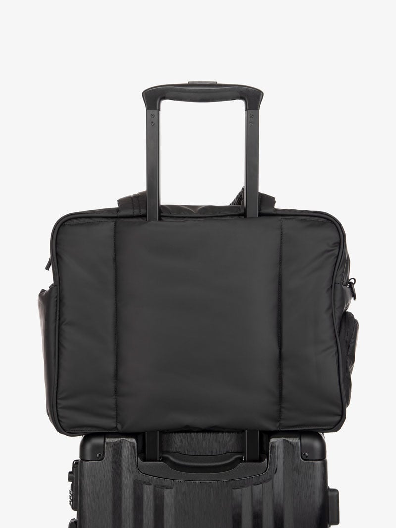 matte black CALPAK Luka weekender bag with trolley sleeve