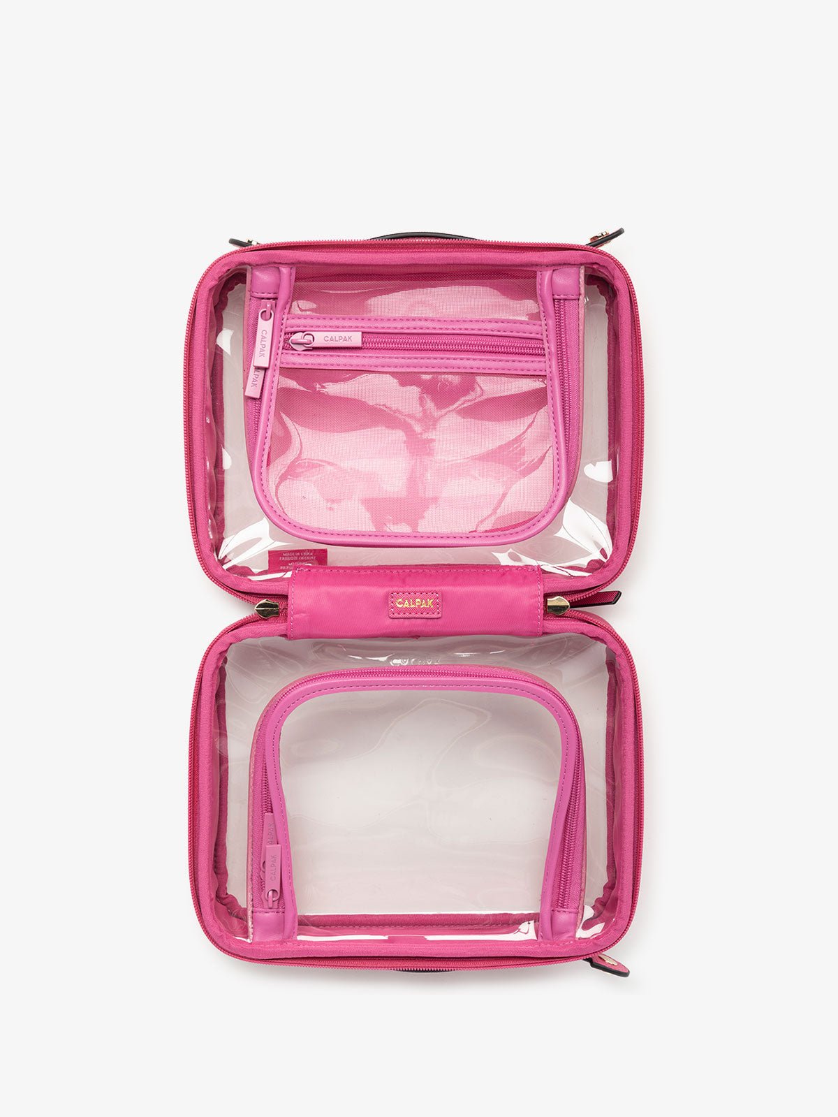 CALPAK clear skincare bag with multiple zippered compartments in dragonfruit pink