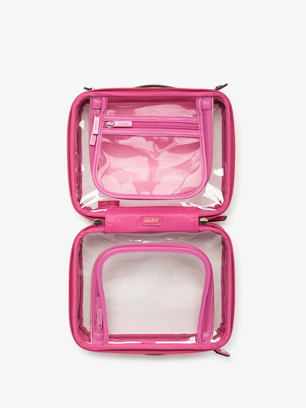 CALPAK clear skincare bag with multiple zippered compartments in dragonfruit pink