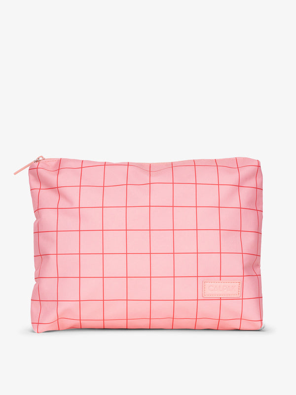CALPAK water-resistant travel pouch for luggage in pink grid