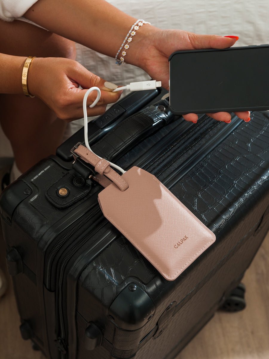 CALPAK portable charger luggage tag in blush pink
