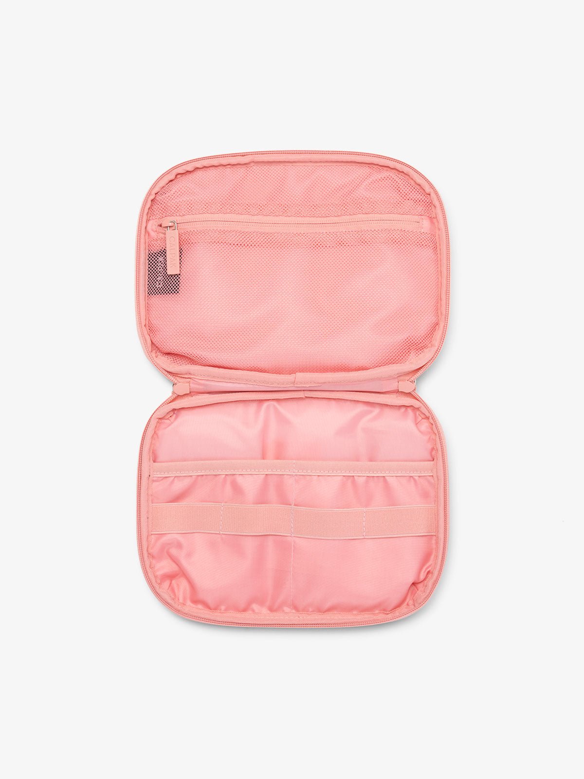CALPAK tech and electronics organizer for travel in pink grid