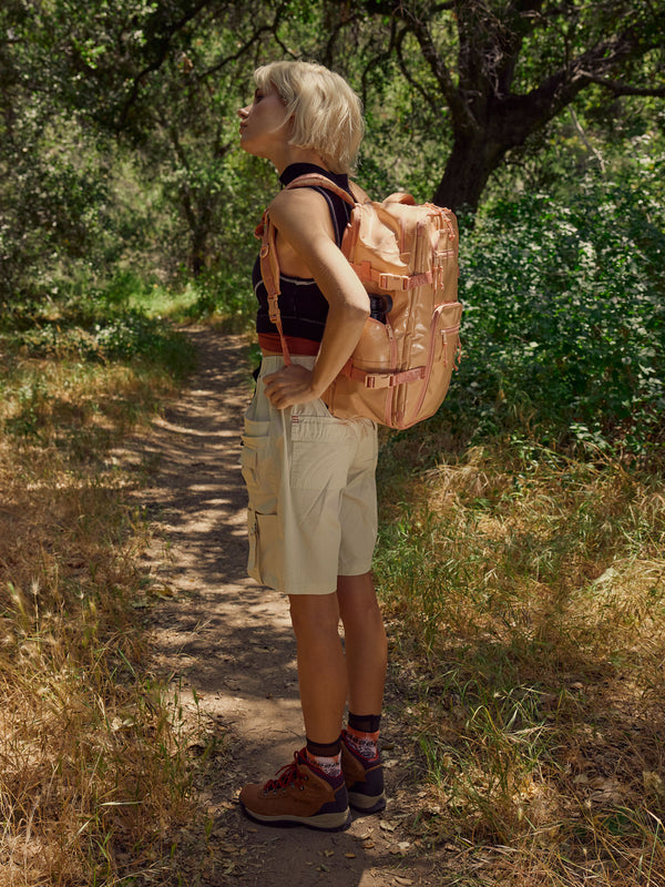 woman with CALPAK Terra 26l backpack duffel for hiking