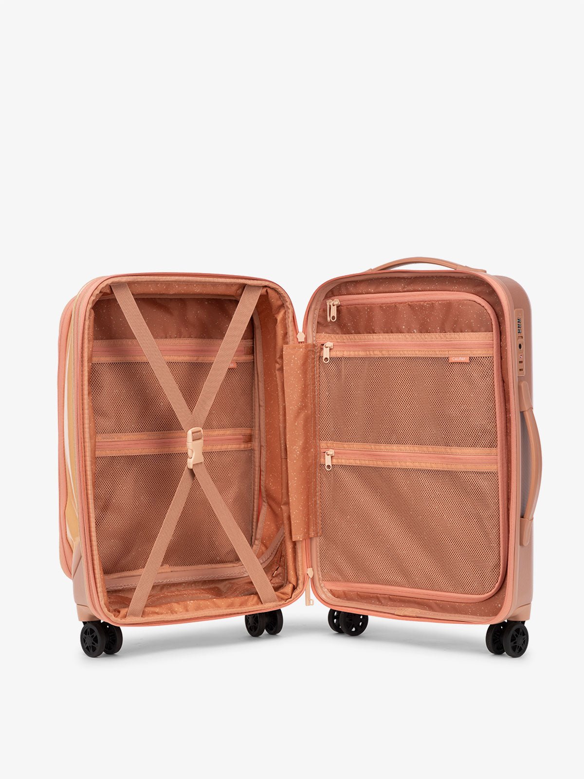 CALPAK Terra Carry-On suitcase interior with multiple pockets and compression strap in canyon