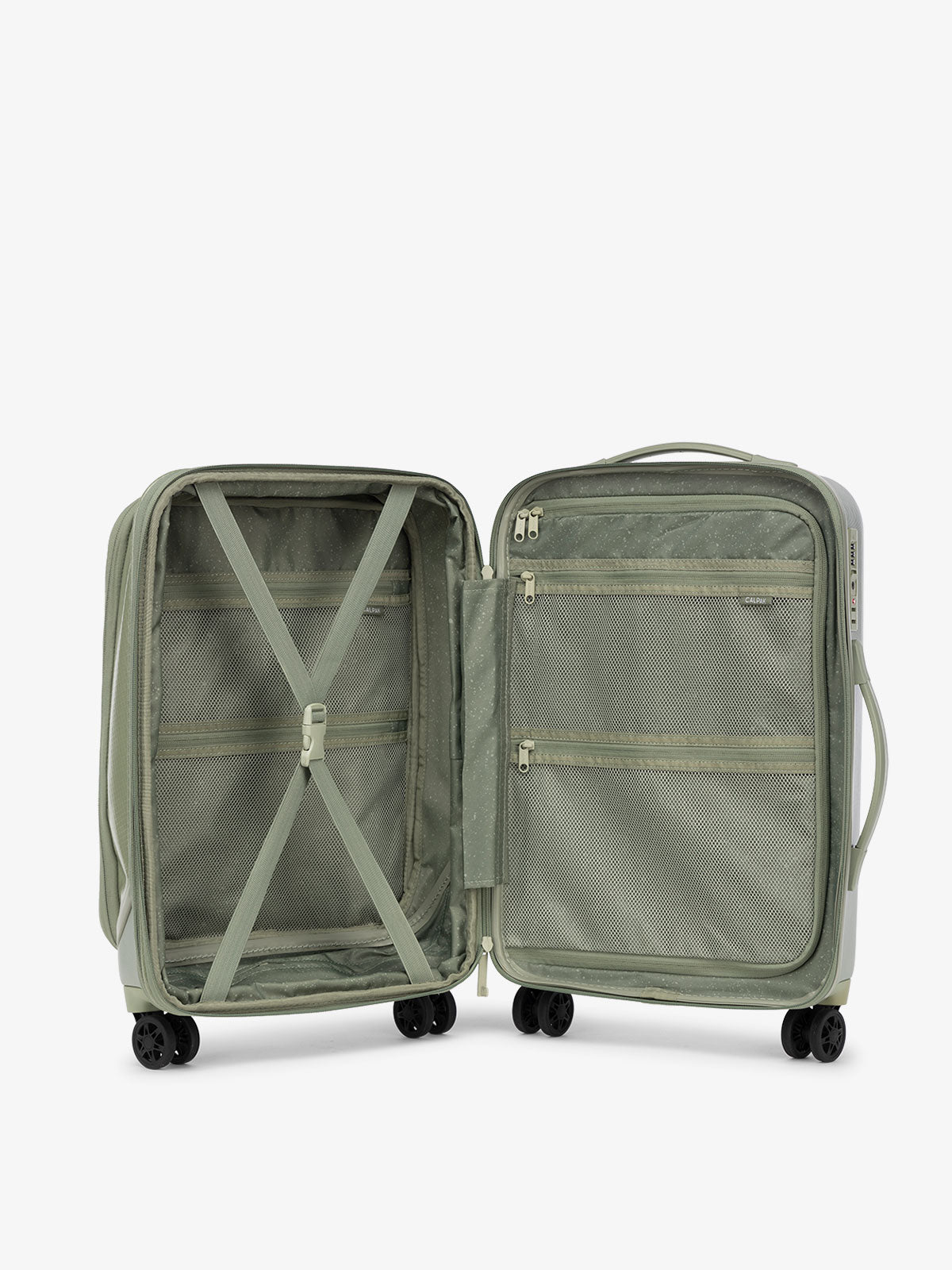 CALPAK Terra Carry-On Luggage interior with multiple pockets and 360 spinner wheels and compression strap in juniper