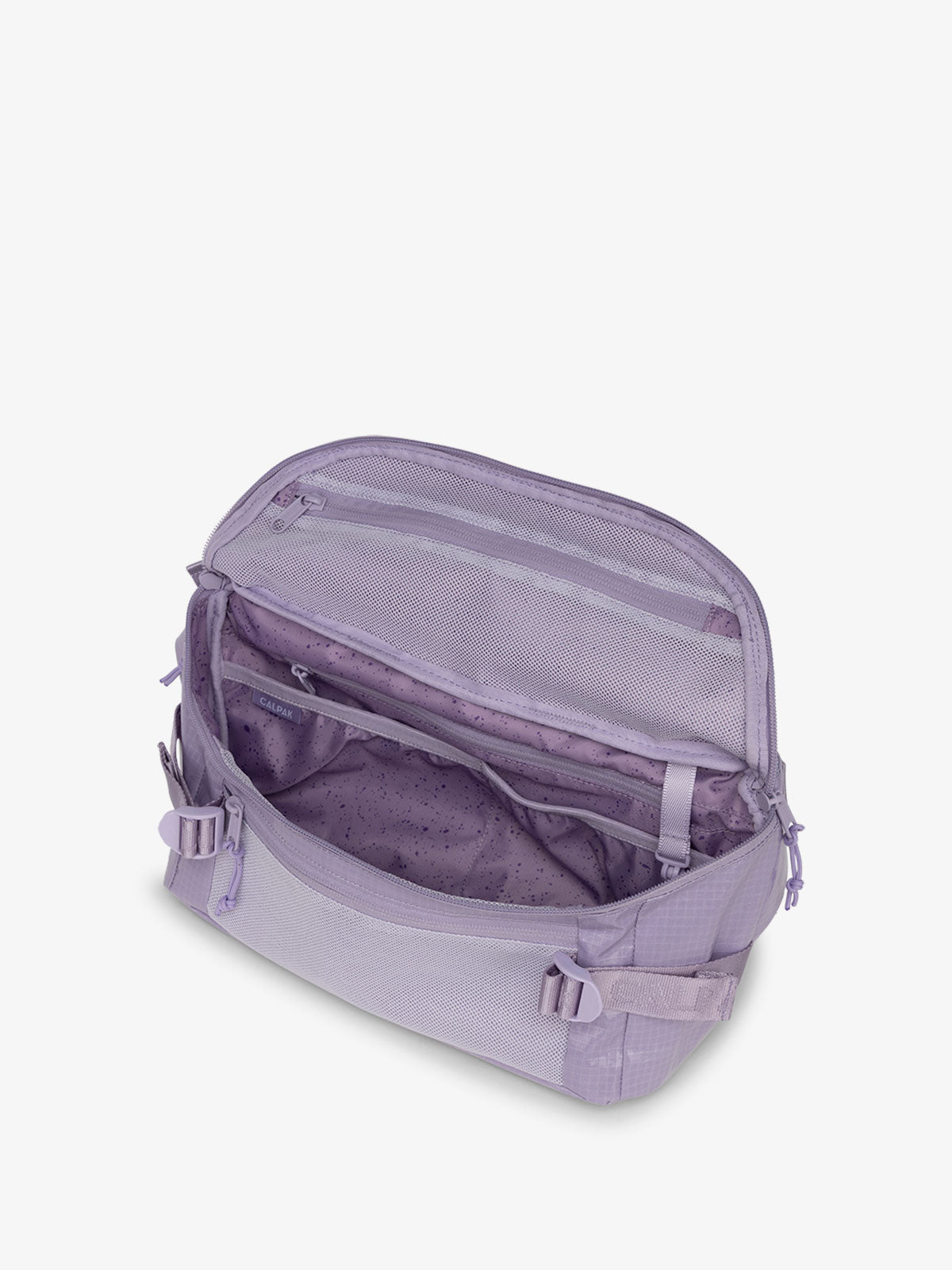 CALPAK Terra Sling Crossbody Bag for hiking with multiple pockets and adjustable straps in purple