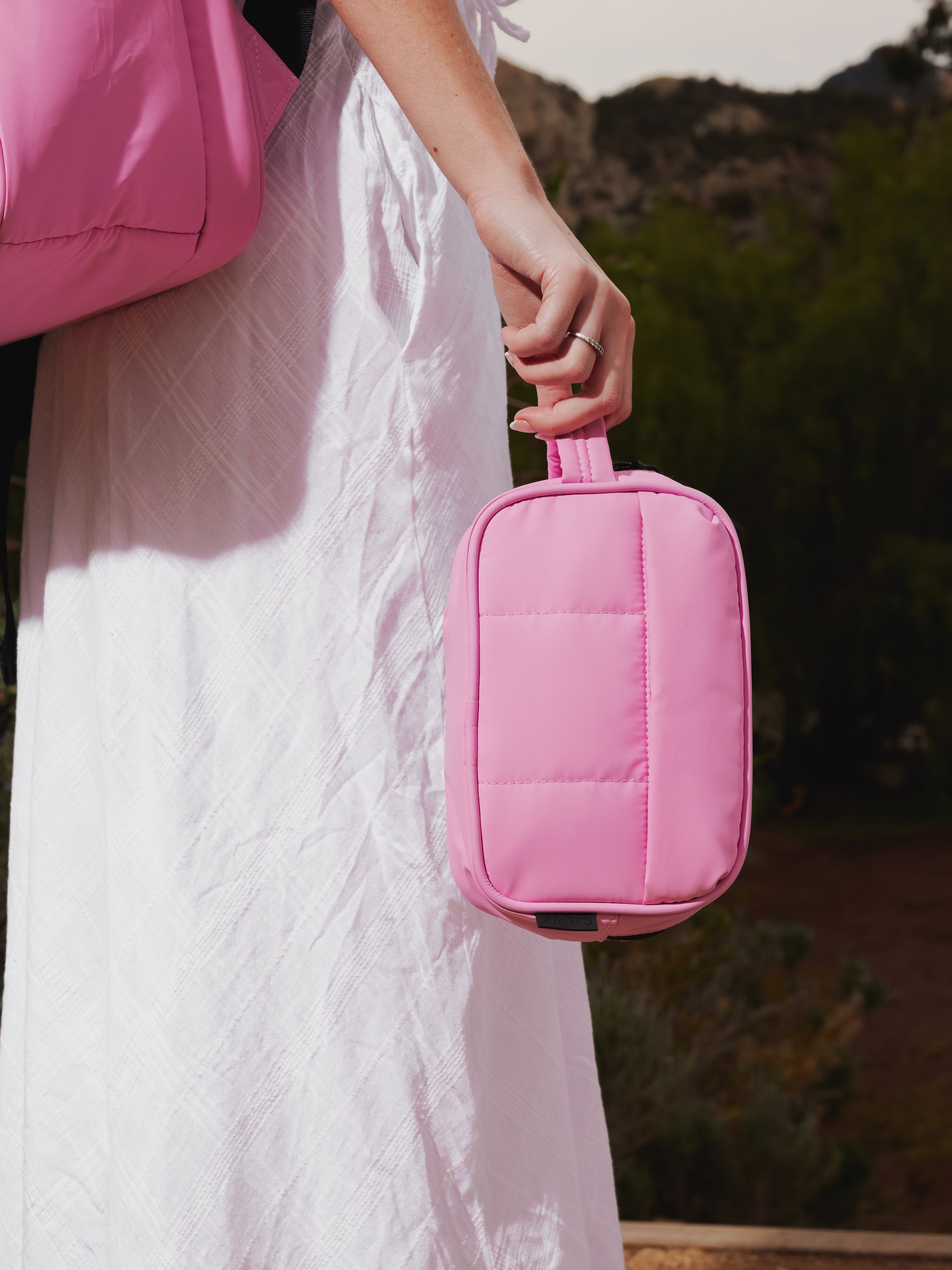 CALPAK Luka Toiletry Bag for women with water resistant lining in pink