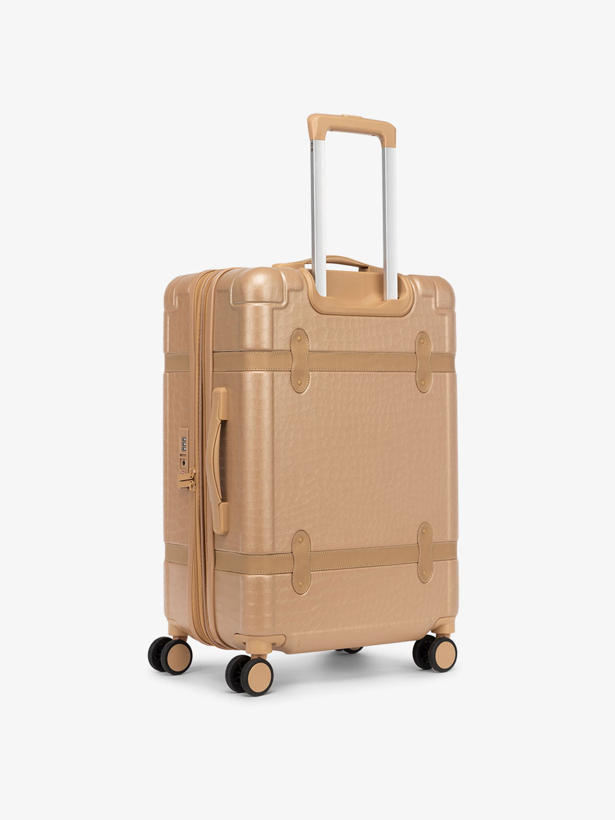 rolling hard shell beige almond suitcase as a part of CALPAK TRNK luggage collection in vintage trunk style