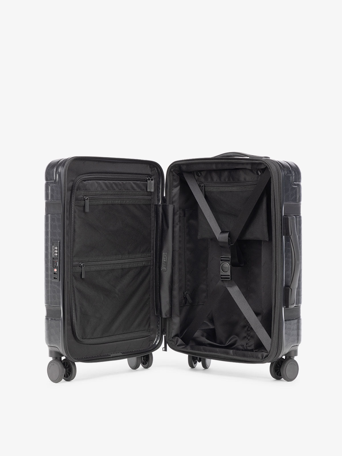 black vintage trunk style CALPAK TRNK luggage with compression straps