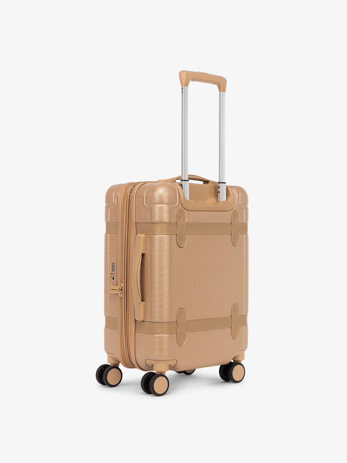 side view of rolling hard shell beige almond luggage
