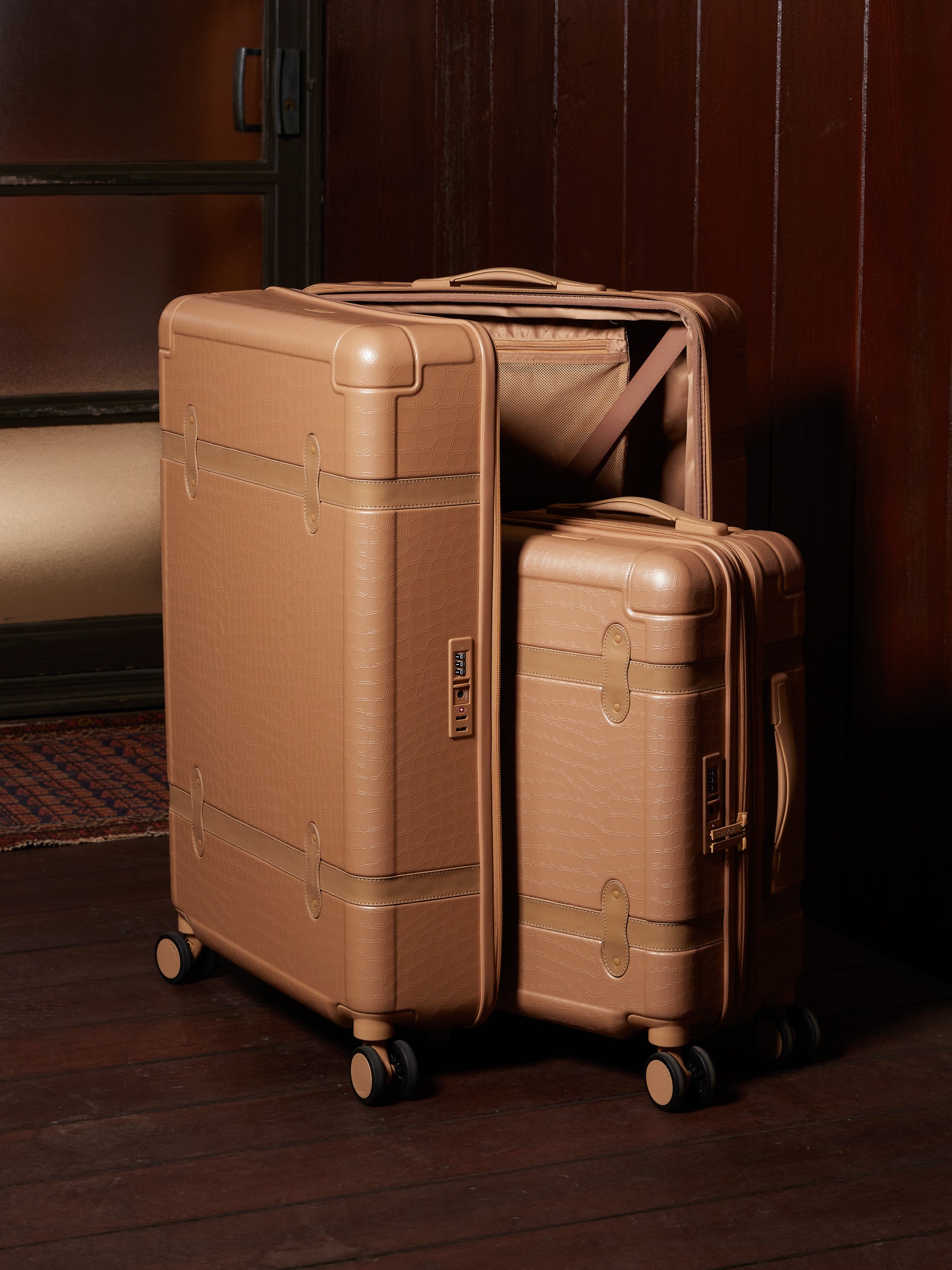 CALPAK TRNK hardside spinner luggages in beige almond color