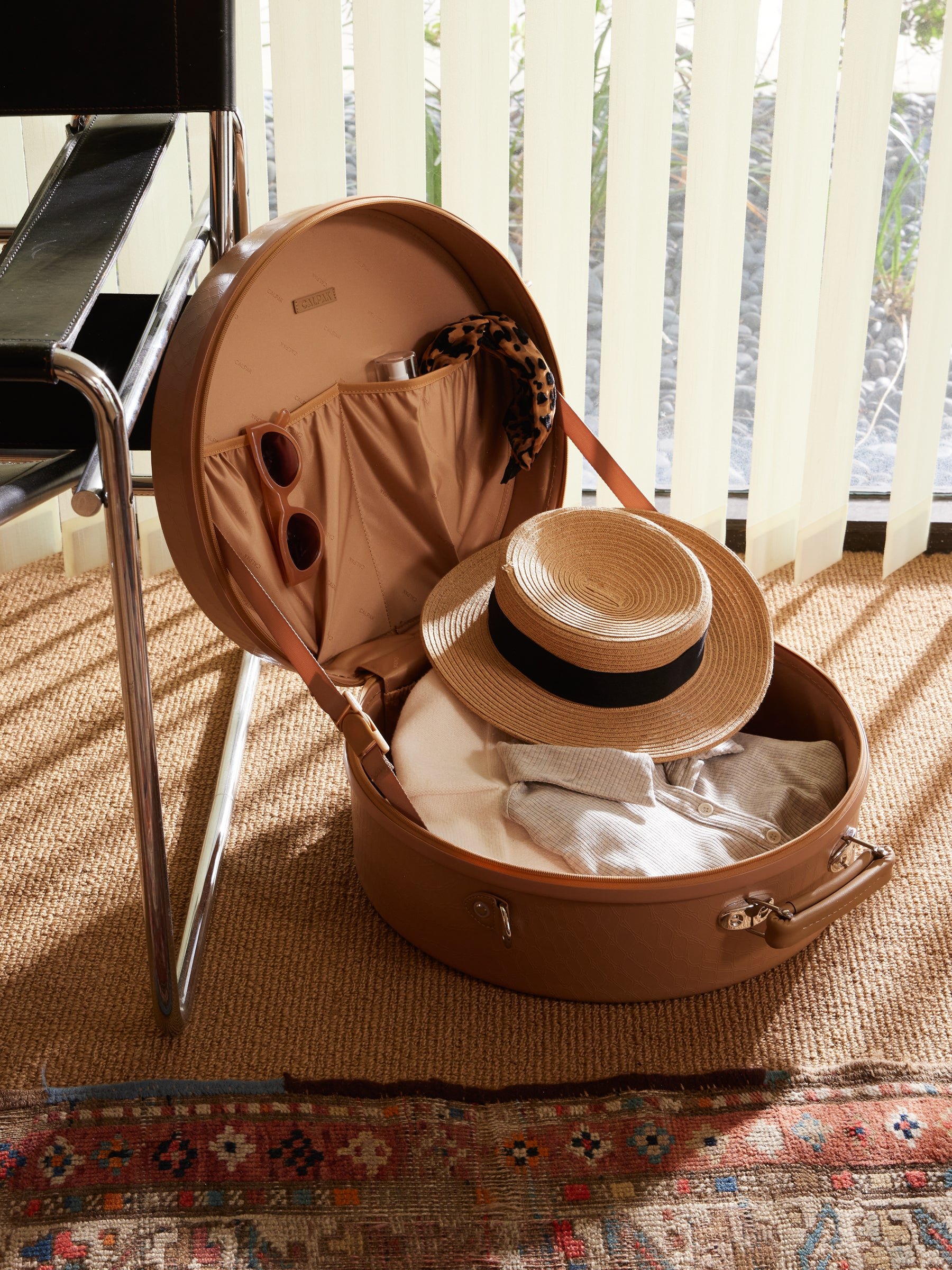 straw sun hat and accessories in CALPAK Trnk Medium Hat Box