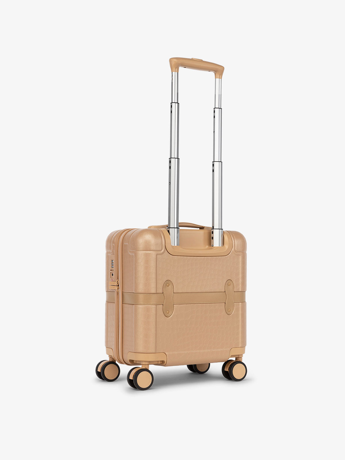 CALPAK mini carry on from the TRNK collection with hard-shell exterior and 360 spinner wheels in almond