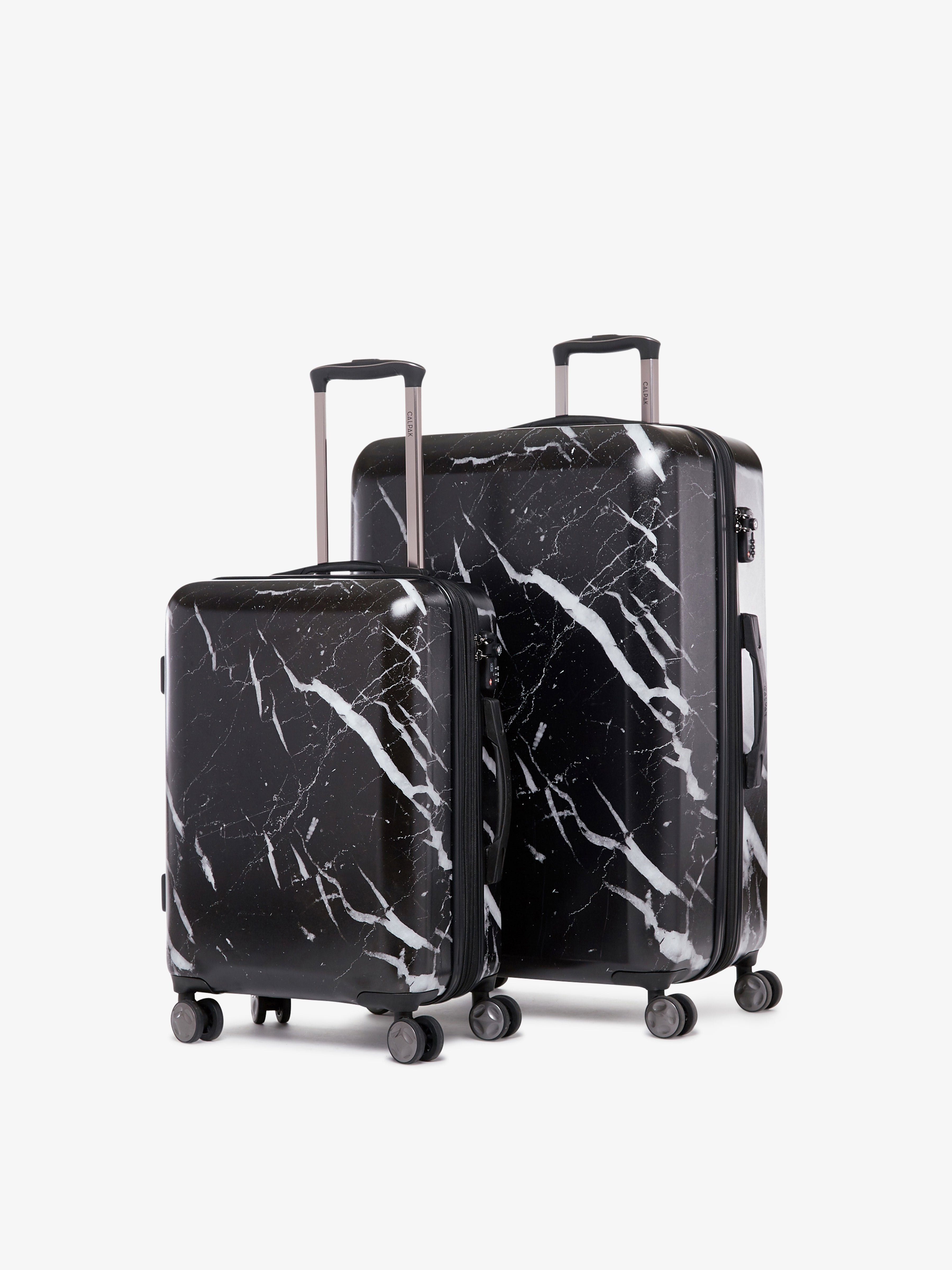 2 piece CALPAK Astyll black marble luggage set that includes a carry on and large suitcase