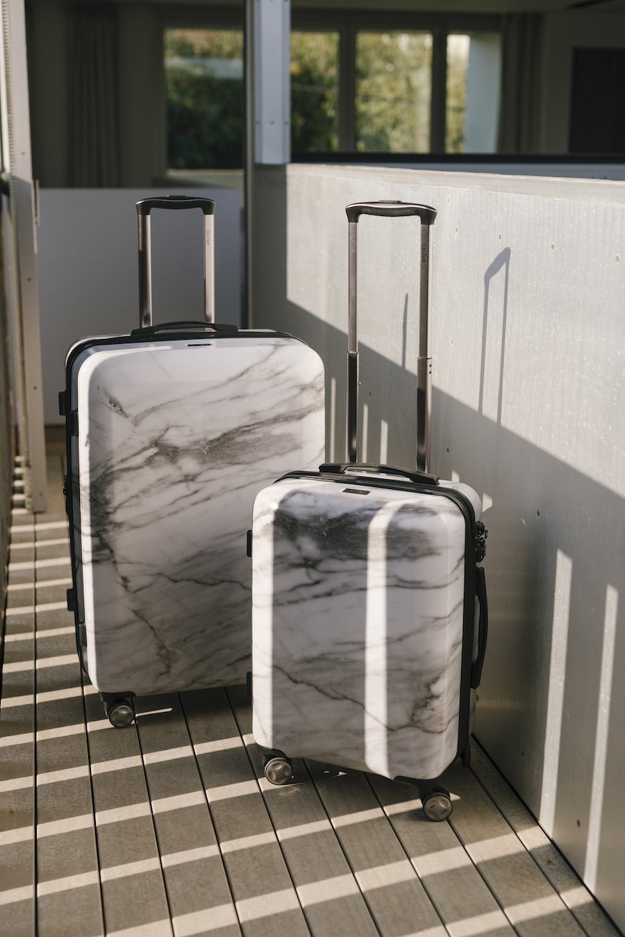 large hardside white marble suitcase and carry on from CALPAK Astyll 2 piece luggage set for women