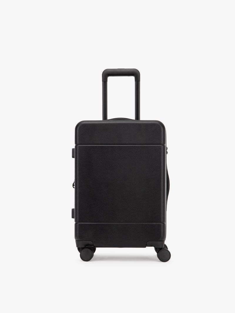 black CALPAK Hue hard shell rolling carry-on luggage