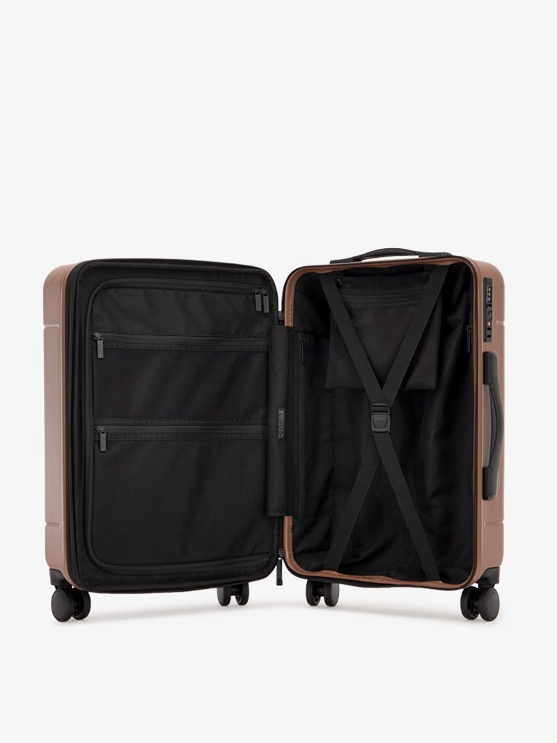 the interior of CALPAK Hue hard shell carry-on spinner luggage in brown hazel color