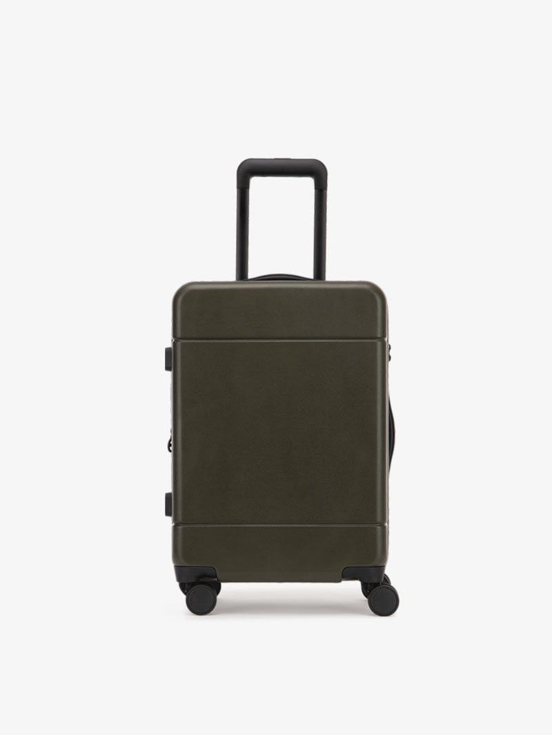 CALPAK Hue hard shell rolling carry-on luggage in green moss color