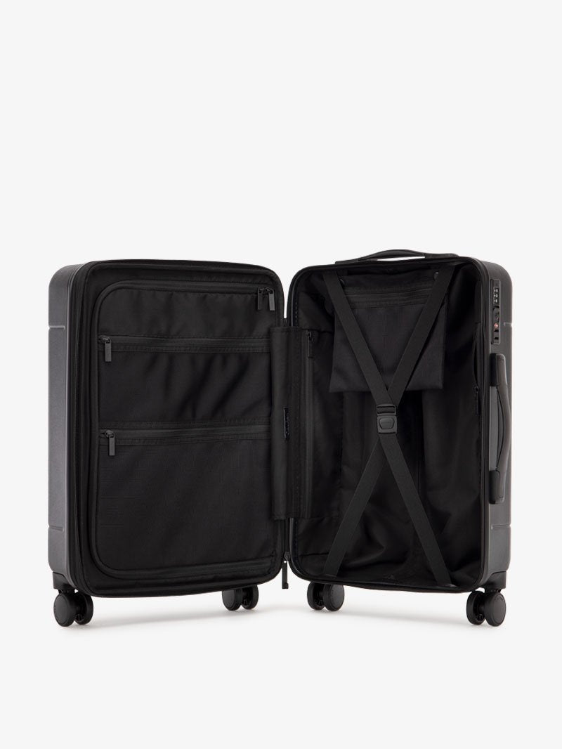 black CALPAK Hue hardside carry on suitcase with laptop compartment and compression straps