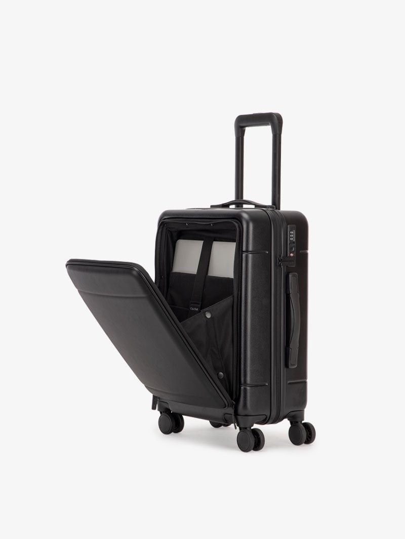 black CALPAK Hue hard shell carry-on spinner luggage with laptop compartment