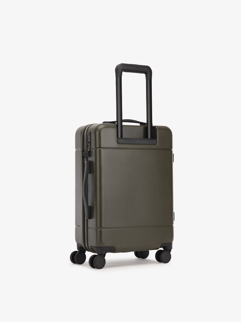 CALPAK Hue leightweight polycarbonate carry-on suitcase with laptop pocket in green moss color