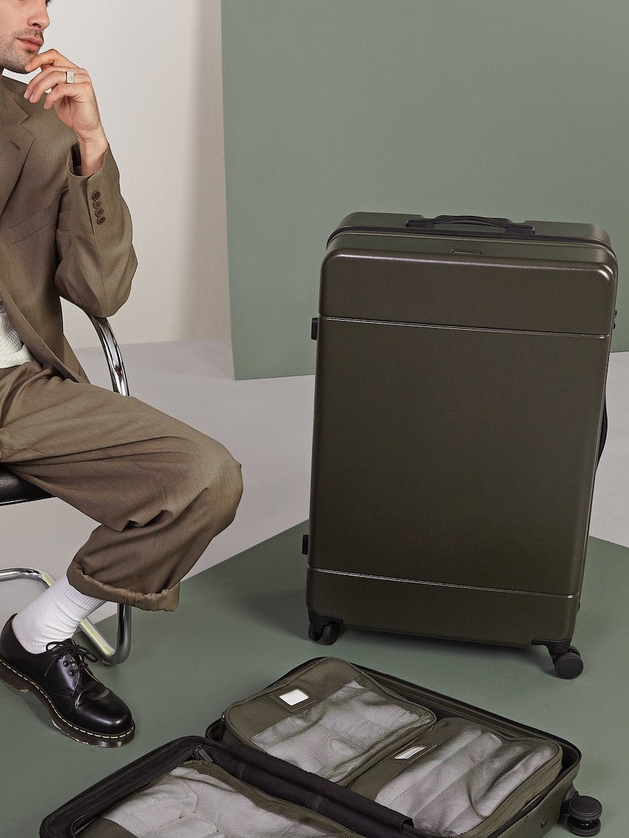 large sturdy luggage in green moss color from CALPAK Hue collection