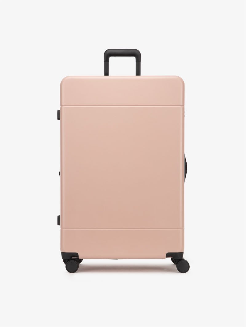 large 30 inch durable hard shell polycarbonate luggage in pink sand color from CALPAK Hue collection