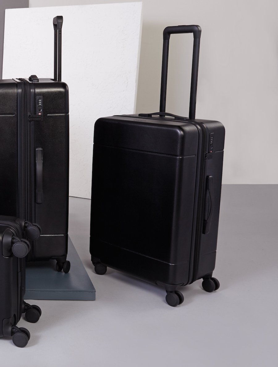 medium 26 inch hardshell stylish minimalist CALPAK Hue suitcase in black color