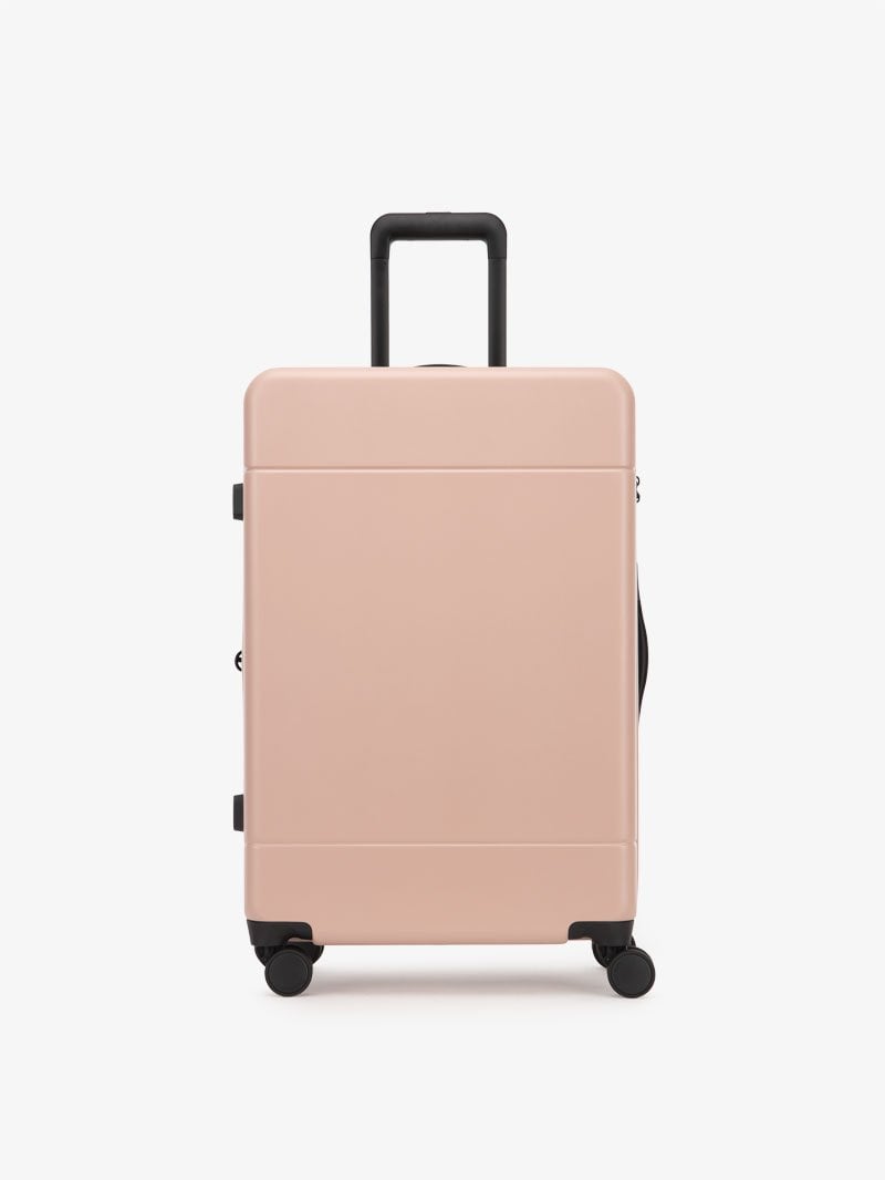 medium 26 inch hardside polycarbonate luggage in pink sand color from CALPAK Hue collection