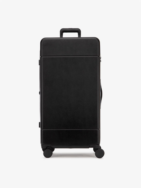 CALPAK Hue 31 inch hardside polycarbonate trunk luggage in black color