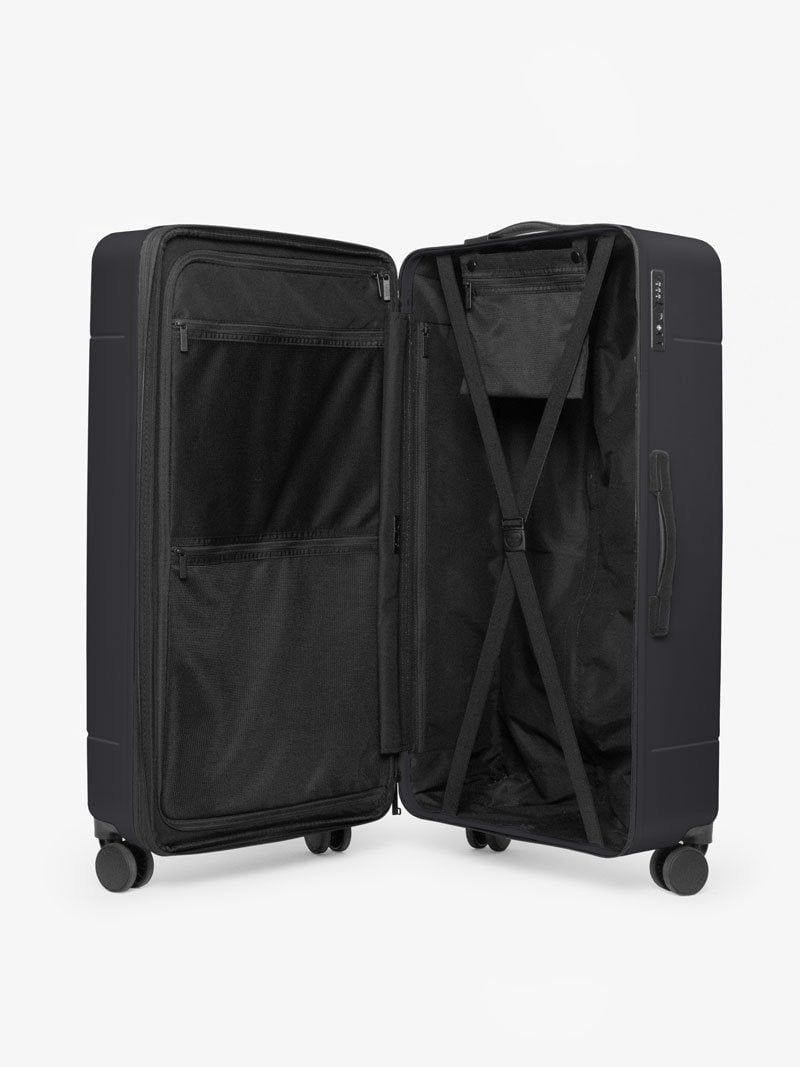 CALPAK Hue trunk suitcase in black with compression straps