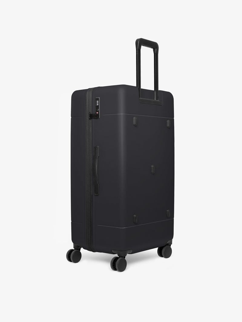 CALPAK Hue 31 inch hard shell trunk luggage with 360 spinner wheels in black color