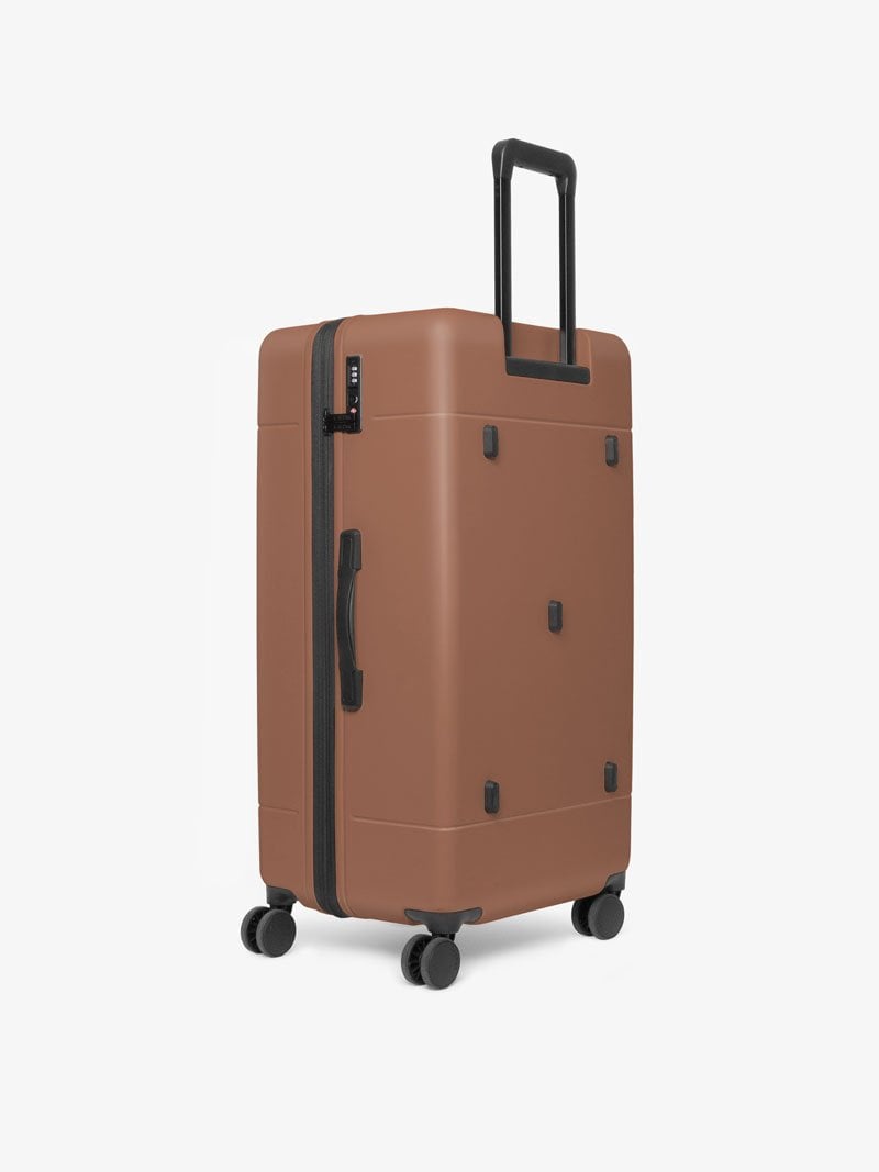 CALPAK Hue 31 inch hard shell trunk luggage with 360 spinner wheels in brown hazel color