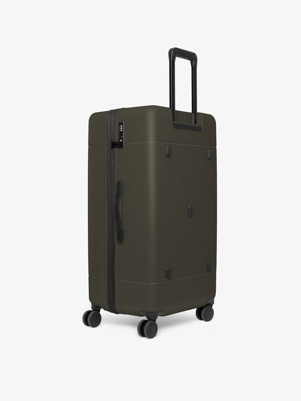 CALPAK Hue big 31 inch hard shell trunk luggage with 360 spinner wheels in green moss color
