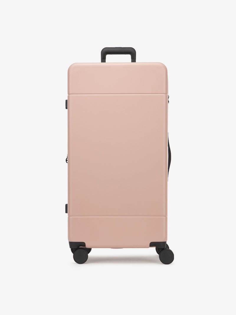 CALPAK Hue 31 inch hardside polycarbonate trunk luggage in pink sand color