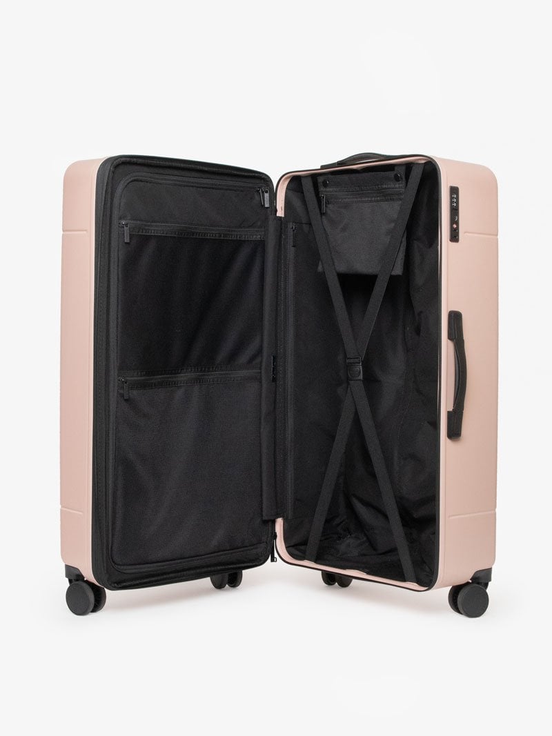 CALPAK Hue trunk suitcase in pink sand color with compression straps