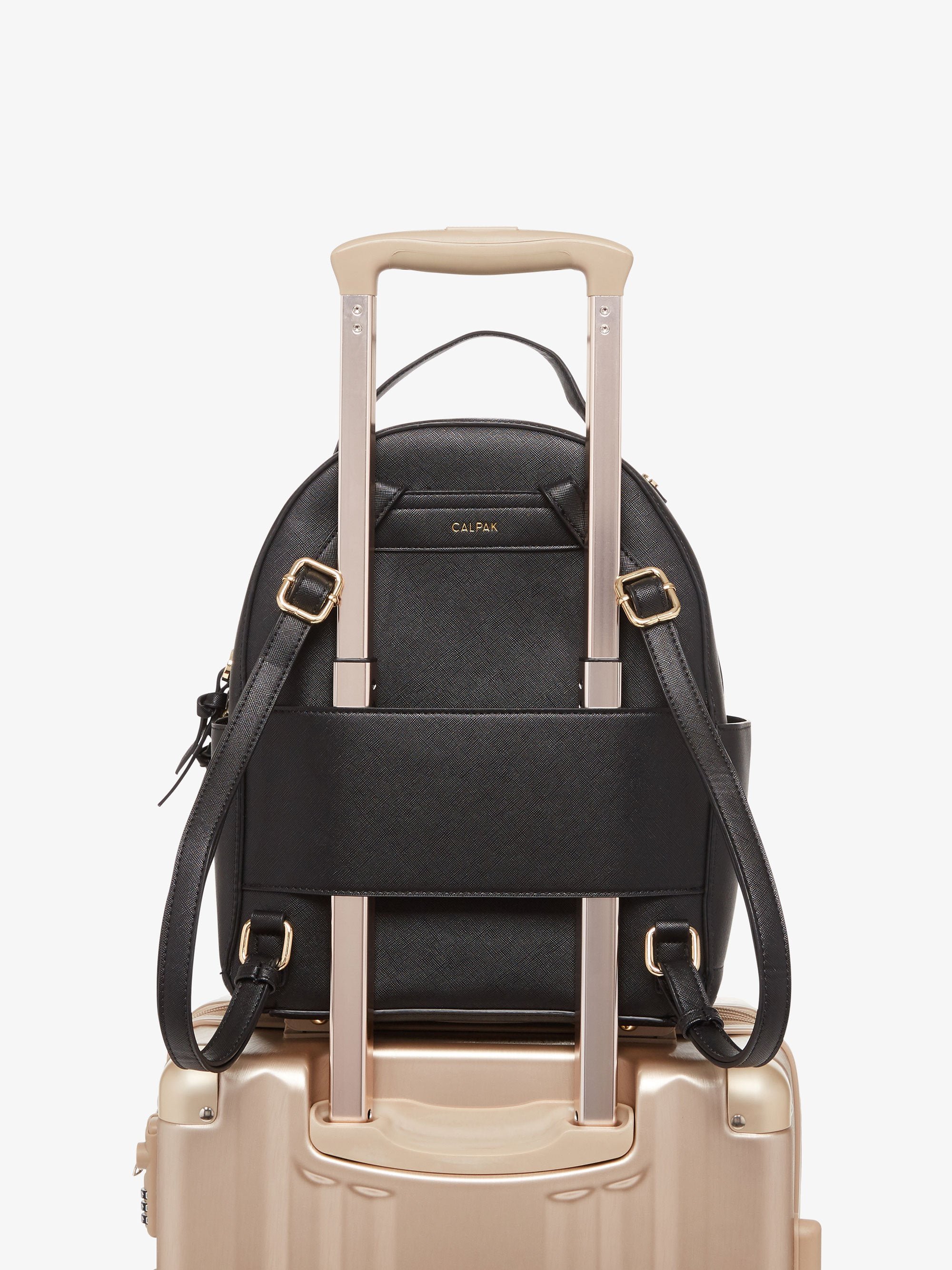 Black CALPAK Kaya backpack with luggage trolley sleeve