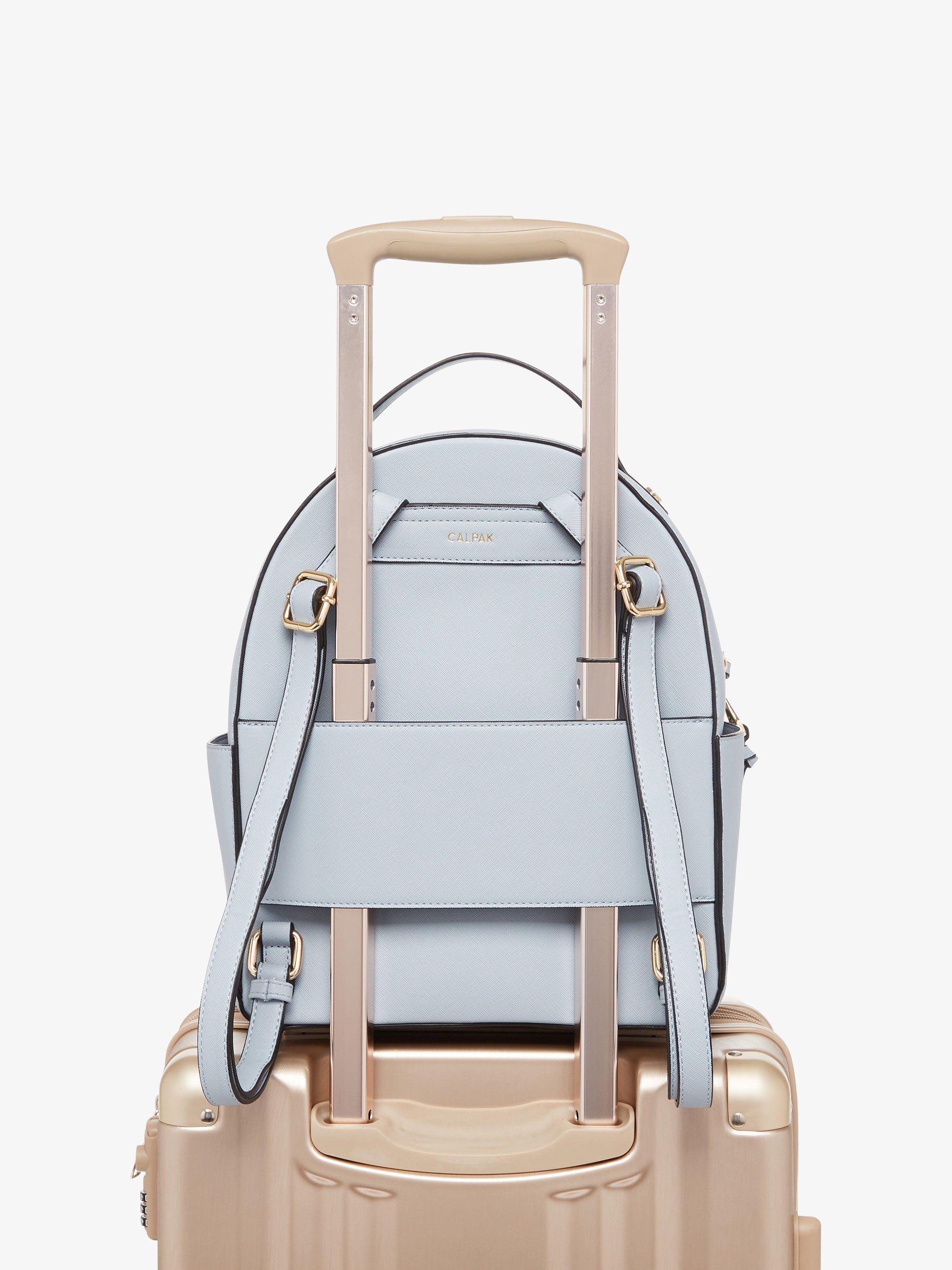 blue denim Kaya backpack with trolley luggage sleeve
