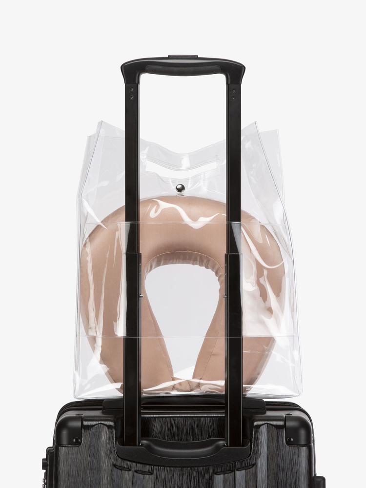 CALPAK rose gold silk travel neck pillow and eye mask in clear carry bag
