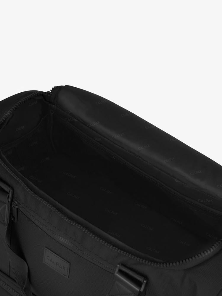 open interior shot of black CALPAK Stevyn duffel bag