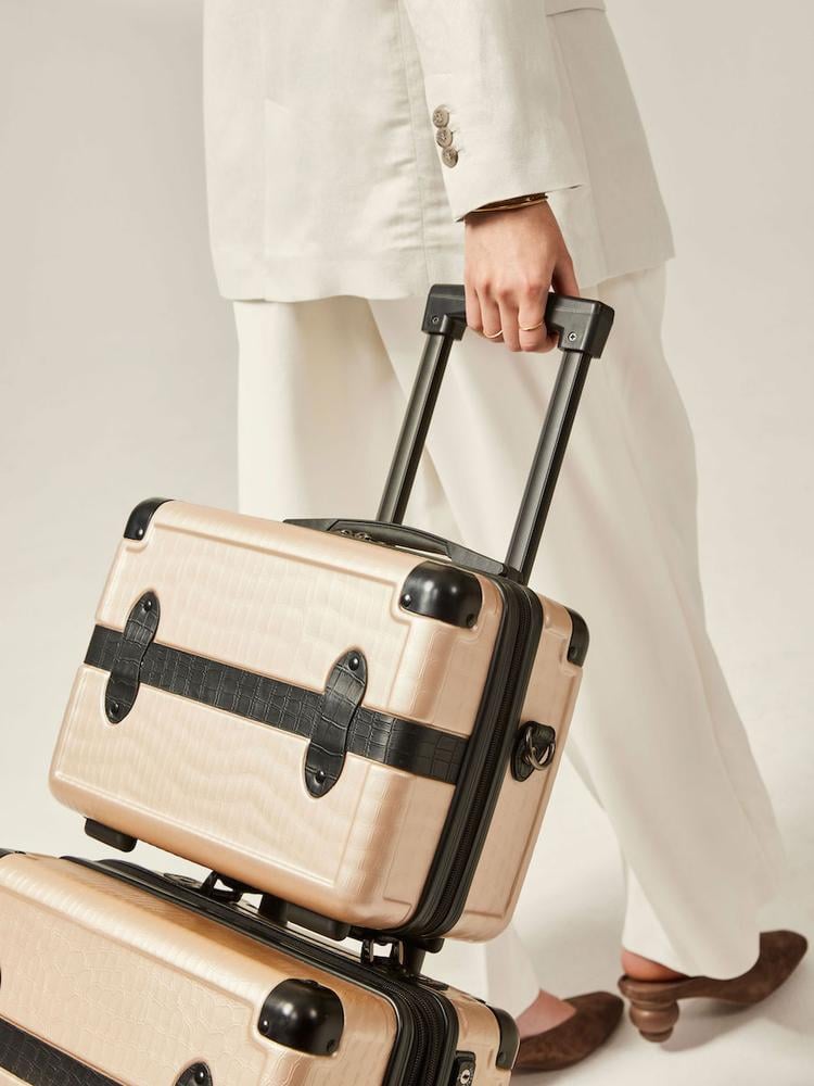 CALPAK TRNK nude travel vanity case with rolling carry on